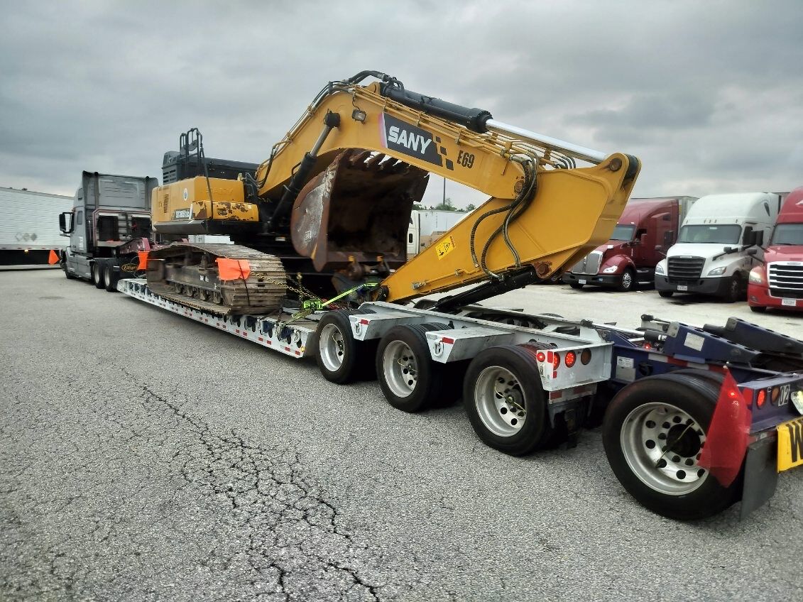 SANY excavator loaded on a beavertail lowboy