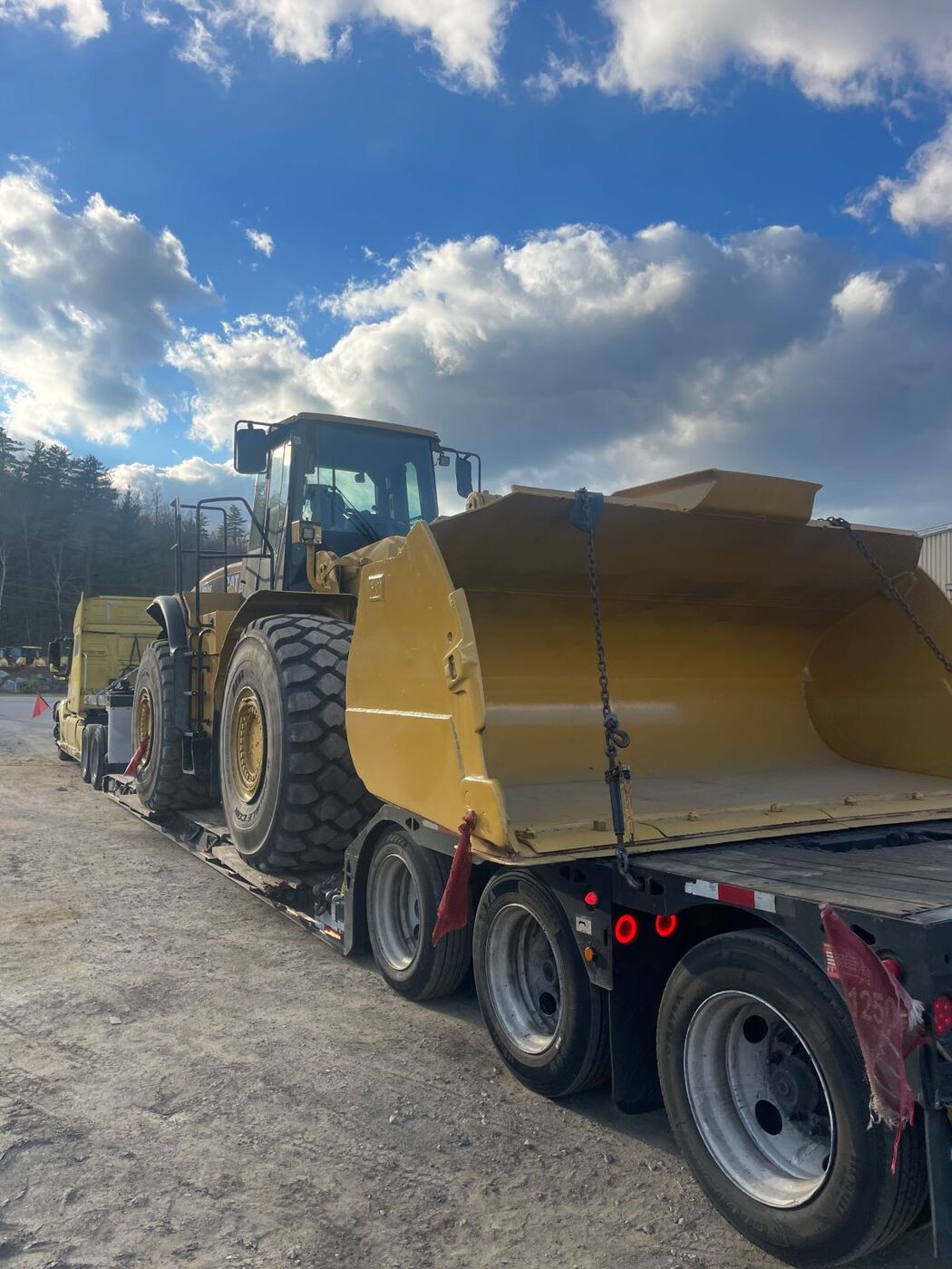 CAT wheel loader on a lowboy trailer